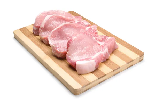 Sliced pork on wooden board isolated on white background. — Stock Photo, Image