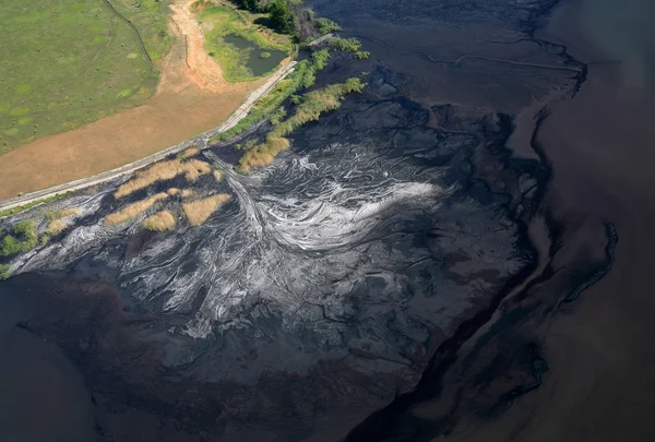 Stream pollution. Aerial view.