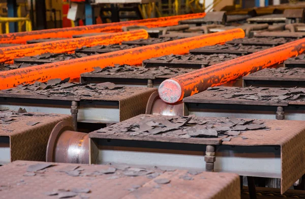 Hot steel on conveyor — Stock Photo, Image