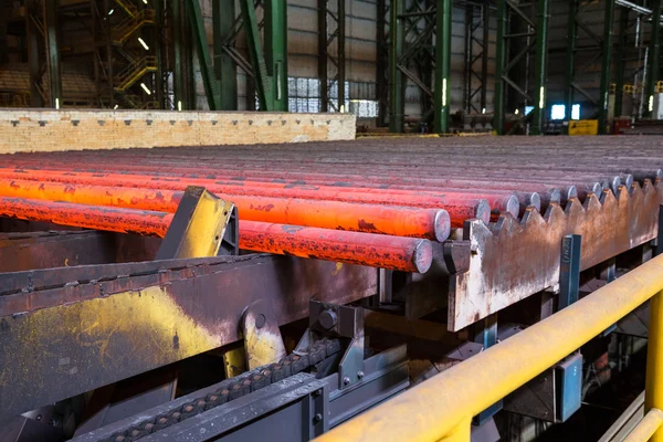 Hot steel on conveyor — Stock Photo, Image