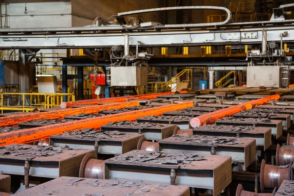 Hot steel on conveyor — Stock Photo, Image