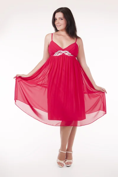 Красива молода жінка в сексуальній червоній вечірній сукні — стокове фото