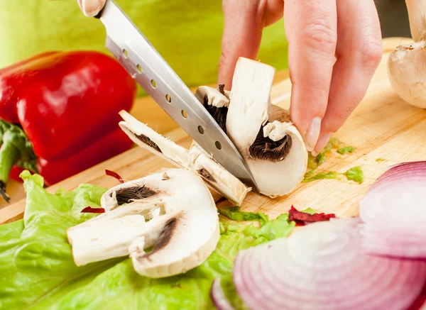 Cutting mushroom champignon — Stock Photo, Image