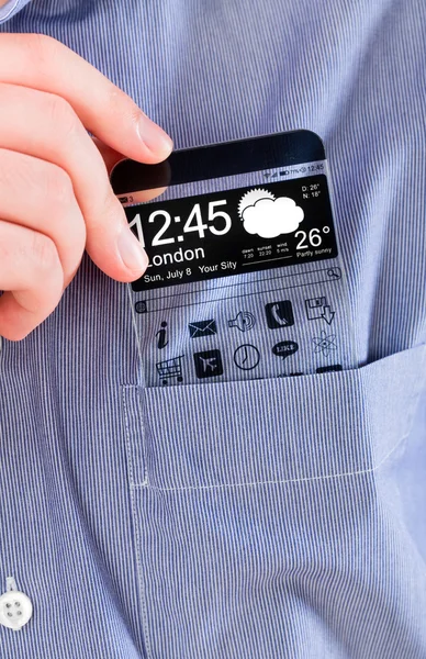 Smartphone con una pantalla transparente en un bolsillo de camisa . — Foto de Stock