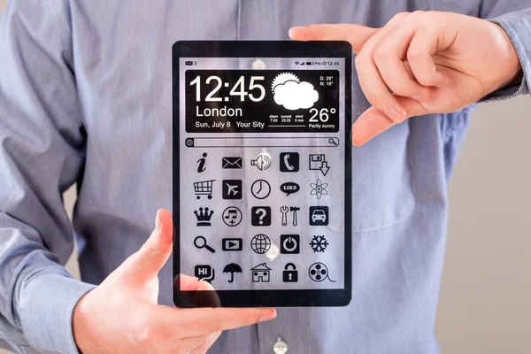 Tablet with transparent screen in human hands. — Stock Photo, Image