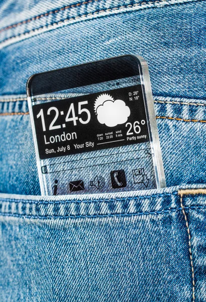 Smartphone con pantalla transparente en un bolsillo de jeans . — Foto de Stock