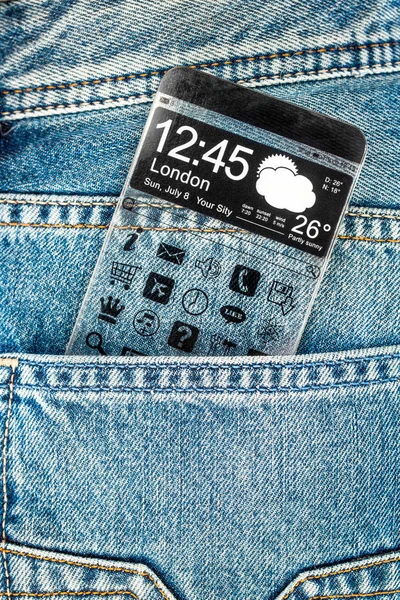 Смартфон с прозрачным экраном в кармане джинсов . — стоковое фото
