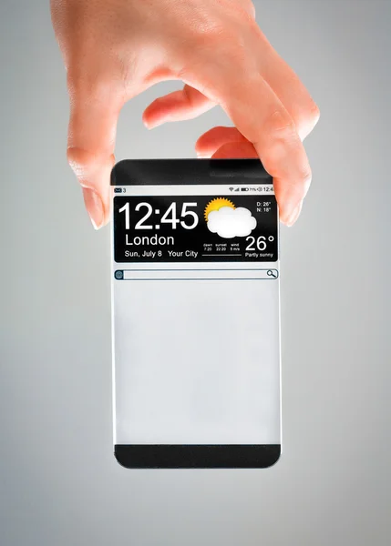 Smartphone con pantalla transparente en manos humanas . — Foto de Stock