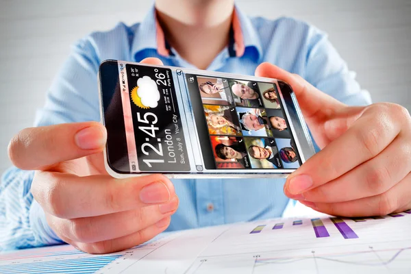 Smartphone with transparent screen in human hands. — Stock Photo, Image