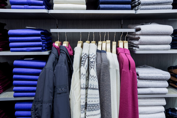 Clothing on hangers in shop