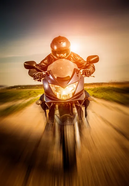 Biker racing on the road — Stock Photo, Image