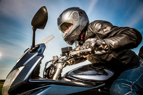 Biker racing on the road — Stock Photo, Image