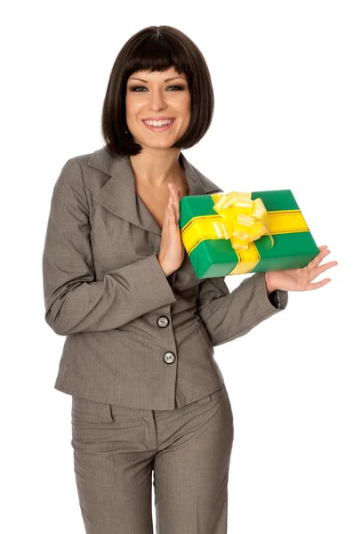 Green box with yellow bow as a gift — Stock Photo, Image
