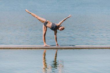 reflection training woman practice yoga at nature