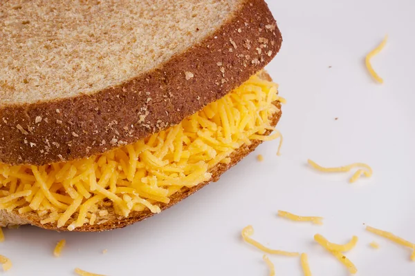 Sandwich with grated cheese — Stock Photo, Image