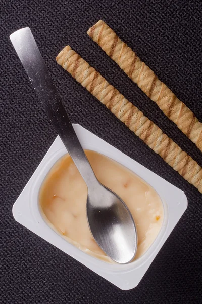 Rolled waffles and yogurt — Stock Photo, Image
