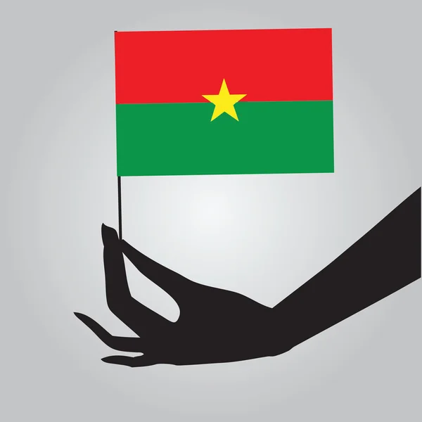 Drapeau du Burkina Faso à la main — Image vectorielle