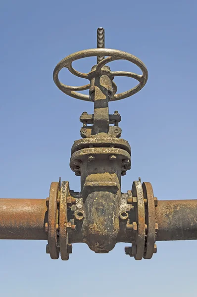 Old pipe with large valve — Stock Photo, Image