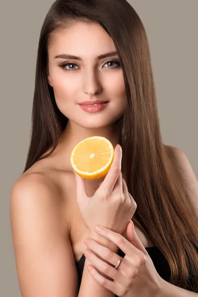 Woman with lemon on white background — Stock Photo, Image