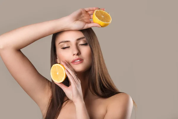 Woman with lemon on white background — Stock Photo, Image