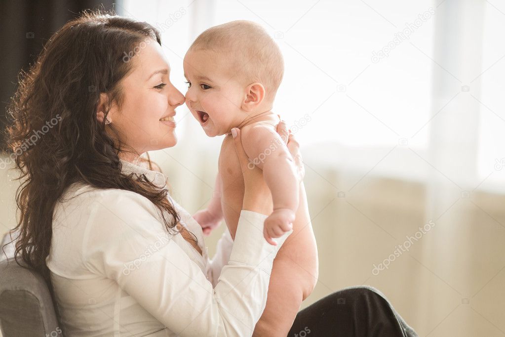 Happy mother with smiling baby