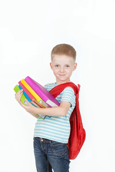 Niño con libros sobre fondo blanco — Foto de Stock