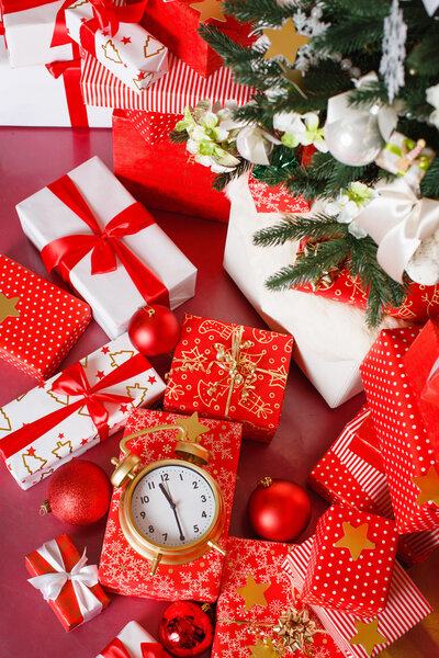 Christmas gifts in red boxes on a red background