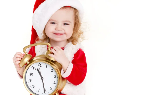 Child holding present wearing santa hat isolated on white — Stock Photo, Image