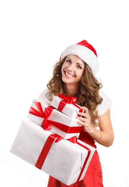 Menina bonita em um boné de Papai Noel com presentes em um fundo branco — Fotografia de Stock