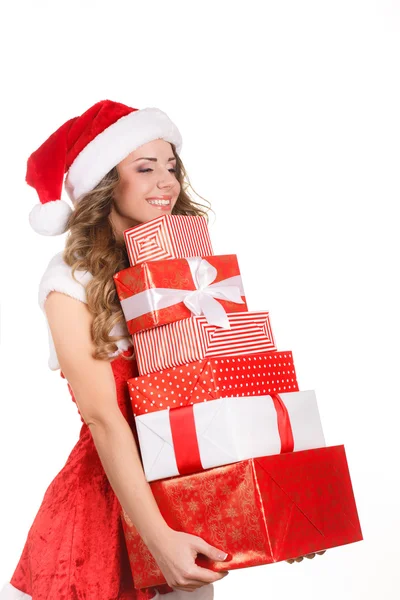 Mujer joven con regalos en Navidad Imágenes De Stock Sin Royalties Gratis