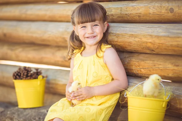 Little girl with chickens — Stock Photo, Image