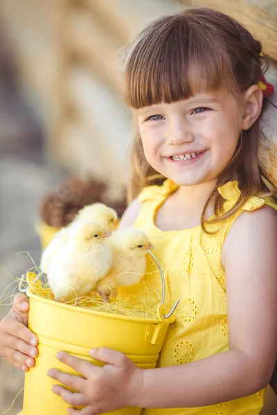 Little girl with chickens — Stock Photo, Image