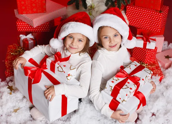 Happy teen sisters decorating Christmas tree — Stock Photo, Image