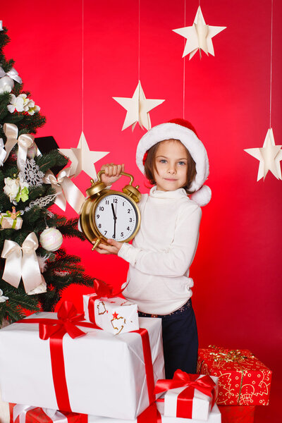 Happy teen sisters decorating Christmas tree