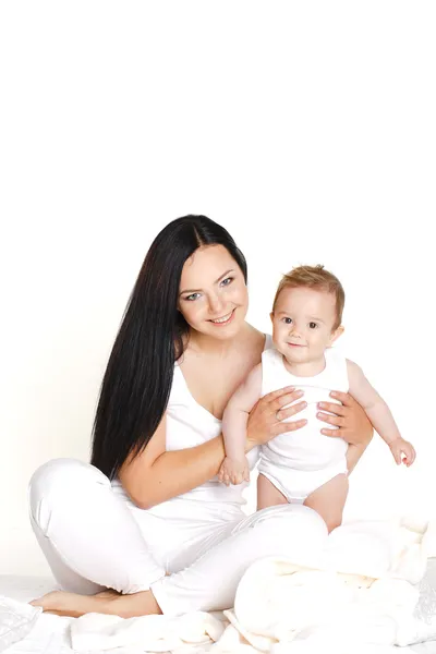 Portrait of mother playing with her baby infant isolated on white background — Stock Photo, Image