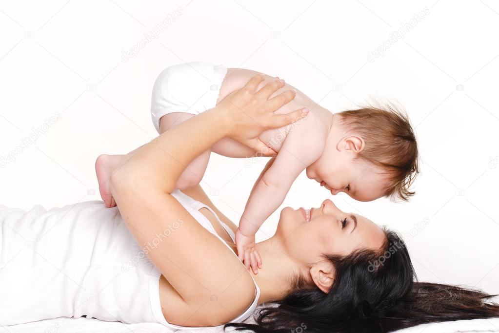 Mother with baby isolated on white. Happy family with newborn.