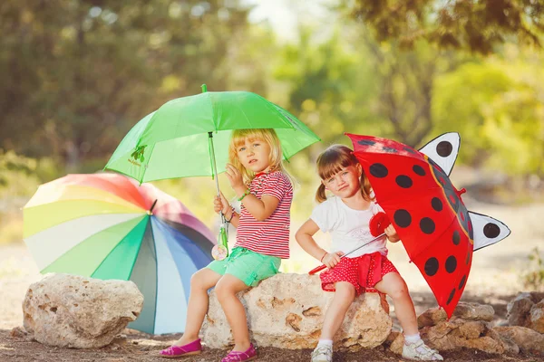 Cute happy children playing in spring filed — Stock Photo, Image