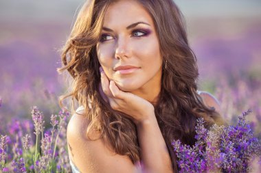 Beautiful woman and a lavender field clipart