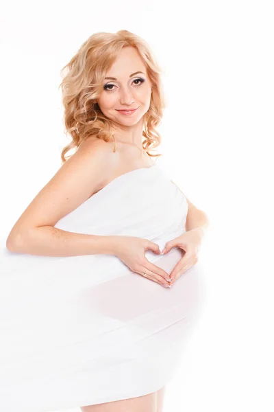 Portrait of a beautiful smiling pregnant woman in white chiffon shawl on white background — Stock Photo, Image