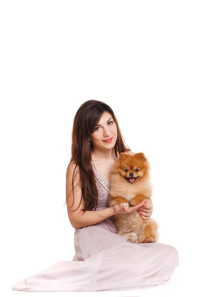 Happy woman and her beautiful little red dog spitz over white background close portrait — Stock Photo, Image