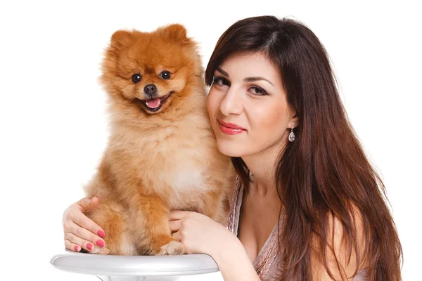 Happy woman and her beautiful little red dog spitz over white background close portrait — Stock Photo, Image