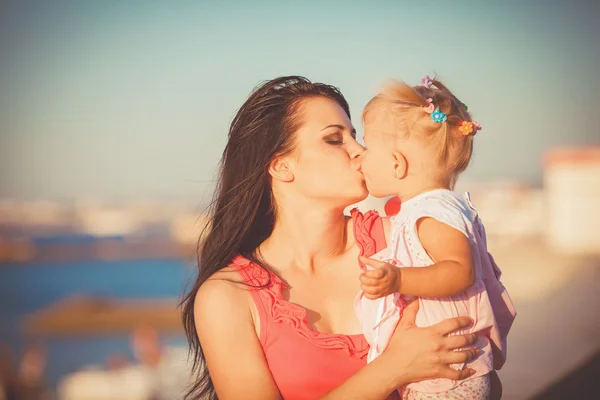 Young mother with child outside on a summer day — Stock Photo, Image