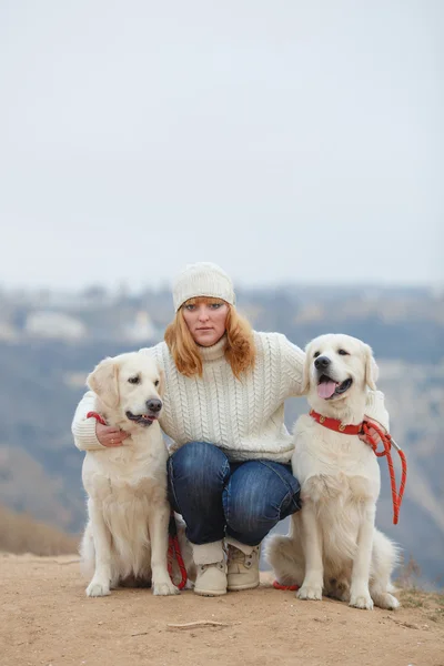 Beautiful girl with her dog near sea — Stock Photo, Image