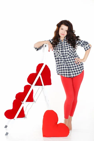 Valentine's Day. Beautiful smiling woman with a gift in the form of heart in his hands — Stock Photo, Image