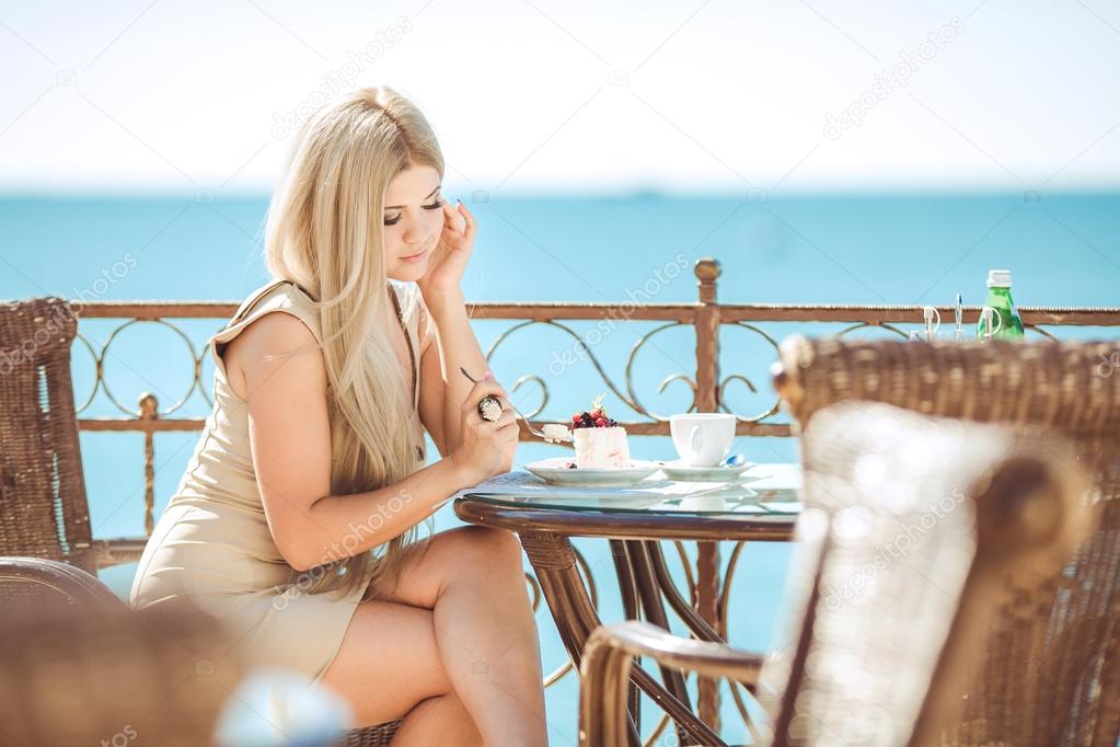 Young woman relaxing in an outdoor cafe