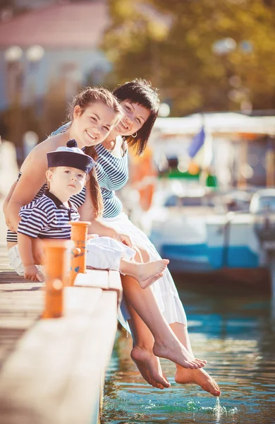 Mom, daughter and son rest in the summer on the beach — Stock Photo, Image