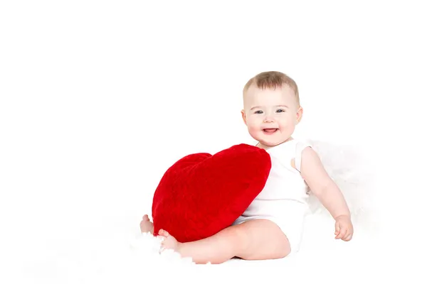 Portrait of a Cute adorable little valentine angel with red soft heart isolated on white background — Stock Photo, Image