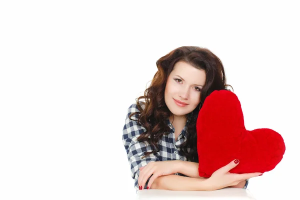 Love and Valentine's Day, a woman holding a red heart. Beautiful brunette woman in love. — Stock Photo, Image