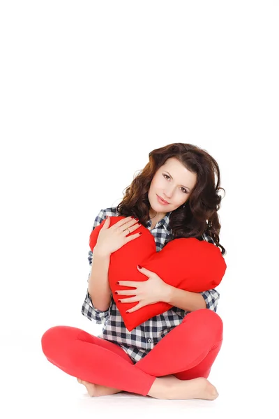 Love and Valentine's Day, a woman holding a red heart. Beautiful brunette woman in love. Stock Picture