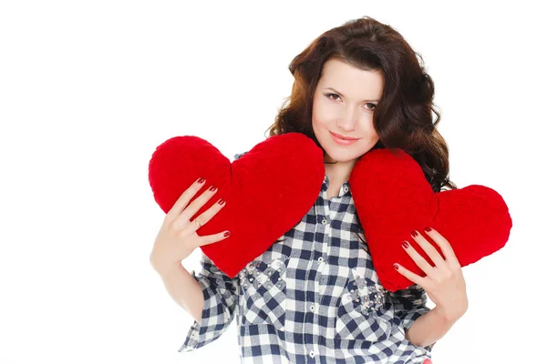Love and Valentine's Day, a woman holding a red heart. Beautiful brunette woman in love. Stock Picture